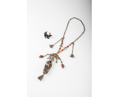 Age: Qing dynasty, 19th century   Description: An impressive Chinese silver, turquoise, and coral necklace with large central