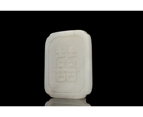 Age: Qing Dynasty  A white jade belt ornament carved with Chinese characters in positive relief framed with a raised border a