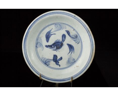 Age: Probably early Ming Dynasty  Description: A porcelain bowl decorated with underglaze blue design of a fish in roundel en
