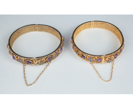Age: 20th century   Description: A finely wrought and attractive pair of Chinese enameled gilt silver and amethyst bangle bra