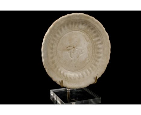 Age: Possibly Yuan dynasty.  Description: An old celadon glazed bowl with a creamy glaze which has a craquelure to the surfac