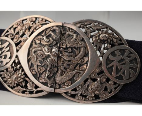 Age: Qing dynasty   Description: A very fine Chinese silver repousse two-part interlocking belt buckle. Skillfully decorated 
