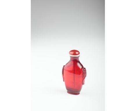 Age: Qing dynasty   Description: A Chinese ruby red Beijing / Peking glass snuff bottle, of flattened tapering ovoid form. We