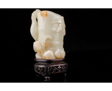 Age: Probably Qianlong Period   Description: A Chinese pale celadon nephrite jade vase in the form of a section of bamboo fla