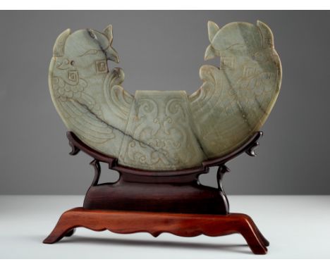 Age: Song Dynasty or later.  Description: A large and impressive jade semi-circle shaped jade carving on a stand, the surface