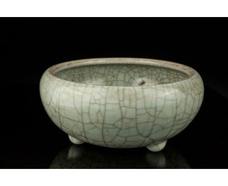 Age: Qing dynasty.   Description: The circular bowl with rounded sides suffused with dark and light brown crackle glaze.   Si