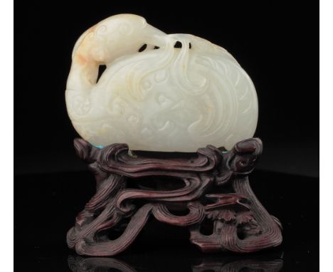 Age: Qing Dynasty  Description: A particularly fine ornament carved in white jade to depict a duck and millet branch. The duc