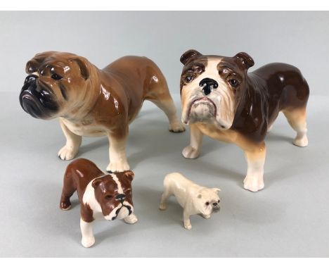 Ceramic Bulldogs, four bulldog figures of varying size, one with Coppercraft trade label to base, one with unreadable stamp o