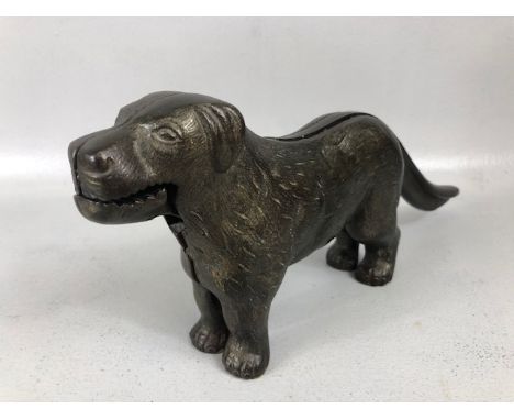 Heavy metal TABLE NUT CRACKER IN THE FORM OF A DOG Early 20th Century Cast with ‘PATENT No. 273480’ to the lever handle, 31cm