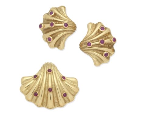 TIFFANY: RUBY-SET SHELL BROOCH/PENDANT AND EARCLIP SUITEThe reeded shell brooch set with cabochon rubies, the earrings of mat