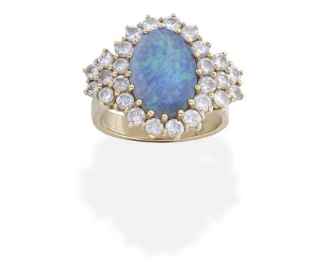 OPAL AND DIAMOND DRESS RINGThe oval opal cabochon, within a brilliant-cut diamond surround, diamonds approx. 1.30cts total, r