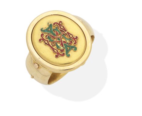 GOLD AND ENAMEL LOCKET/BANGLE, LATE 19TH CENTURYThe hinged bangle with central compartment opening to reveal a removable lock