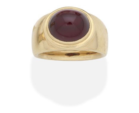 GEM-SET DRESS RINGThe red gemstone cabochon set within a tiered polished mount, ring size approx. SFootnotes:Please note this