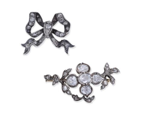 DIAMOND BROOCH AND JEWEL, 19TH CENTURY1st: The flowerhead set with cushion and pear-shaped diamonds and leaves accented with 