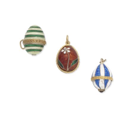 THREE ENAMEL EGG PENDANTS1st: Decorated with a white and green enamel flower, set with an old brilliant-cut diamond on a red 