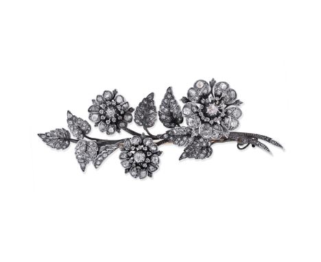 DIAMOND FLORAL SPRAY BROOCH, LATE 19TH CENTURYDesigned as a stem of leaves and flowers, set throughout with rose-cut and cush