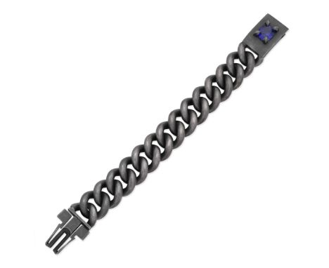 TANZANITE-SET SILVER BRACELETOf heavy blackened silver curb-linking, the clasp set with an oval-cut tanzanite, length 20.3cmF
