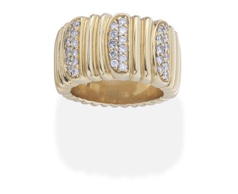 CARTIER: DIAMOND-SET RING, CIRCA 1993Of reeded design, set with three double-rows of brilliant-cut diamonds, signed Cartier 1