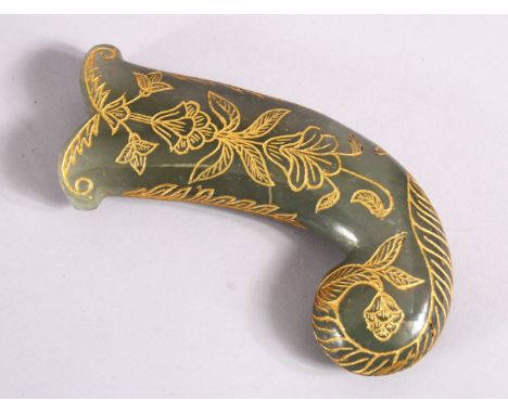 A 19TH / 20TH CENTURY CARVED JADE MUGHAL DAGGER HANDLE - with carved and gilded motif decoration, 13cm