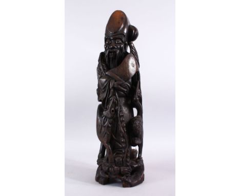 A LARGE 19TH / 20TH CENTURY CHINESE HARDWOOD &amp; SILVER INLAID FIGURE OF SHOU LAO, stood aside deer and cranes, holding his