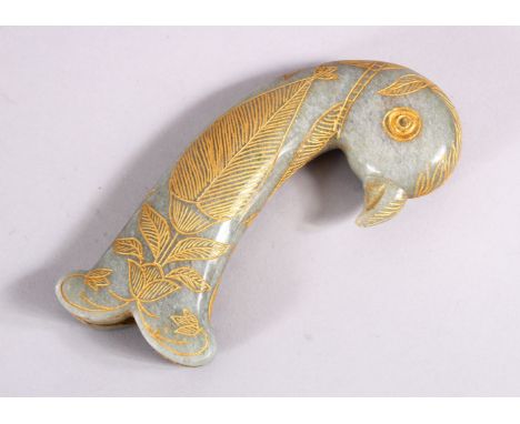 A 19TH / 20TH CENTURY CARVED JADE MUGHAL DAGGER HANDLE - in the form of a parrot, with gilded decoration, 13cm.