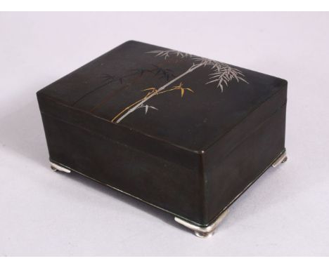 A JAPANESE MEIJI PERIOD SHIBUICHI, GOLD &amp; MIXED METAL CIGARETTE BOX - KURODA COMPANY, the box lid inlaid with gold, silve