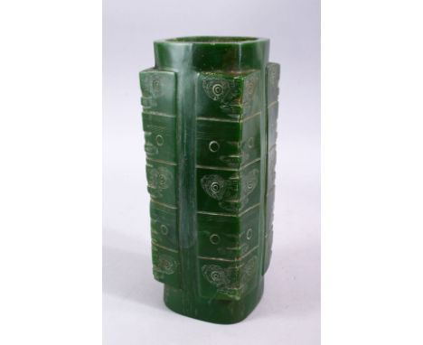 A CHINESE CARVED JADE STYLE ARCHAIC CONG VASE, with carved archaic decoration, 29.5cm high.