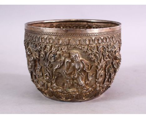 A FINE 19TH CENTURY BURMESE SILVER EMBOSSED BOWL, decorated with figures in panels, with animals and flora, 12cm diameter 9cm