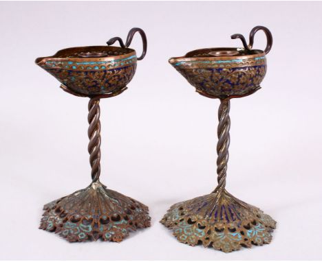 A PAIR OF 19TH CENTURY ISLAMIC KASHMIRI ENAMEL CANDLESTICKS, formed as pourers, with openwork bases, 19cm.