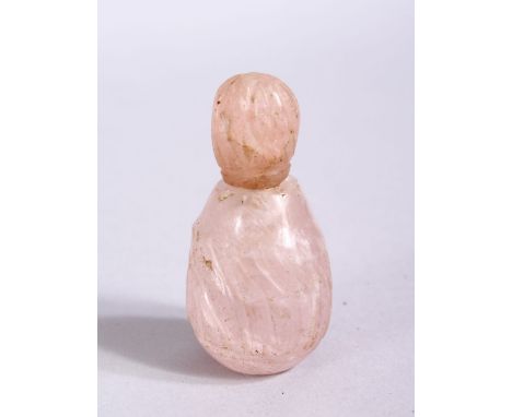 A GOOD 18TH / 19TH CENTURY MUGHAL CARVED ROCK CRYSTAL OR AMETHYST SCENT BOTTLE, carved with 6CM