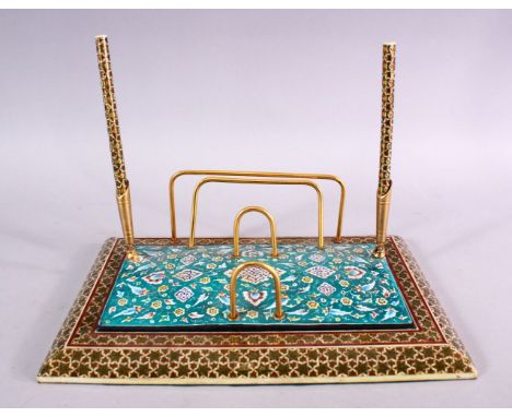 A PERSIAN MICRO MOSAIC &amp; ENAMEL DESK STAND, with enamel decoration depicting flora upon turquoise base, 29cm x 19cm.