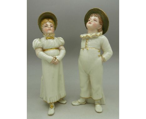 A pair of Royal Worcester figures, girl and boy, height 18cm