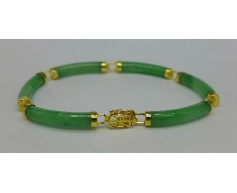 A silver gilt and jade bracelet