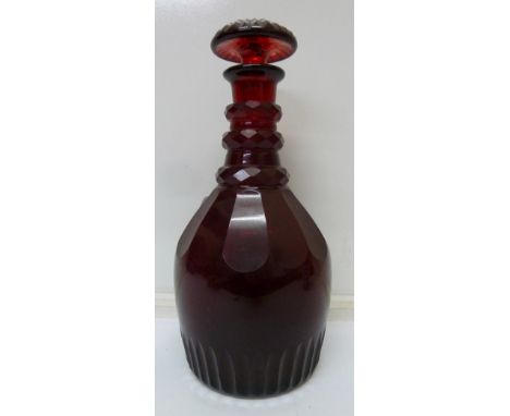 A ruby red glass Bohemian decanter, chips to stopper