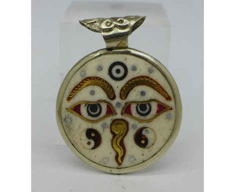 A white metal mounted enamel and yellow metal overlay pendant with Yin Yang symbol