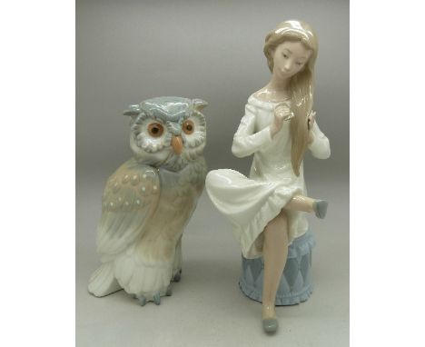 A Nao figure of an owl and a Nao figure of a girl