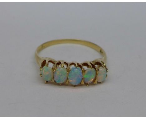 A gold and five stone opal ring, hallmark worn, weight 2.9g, size Q