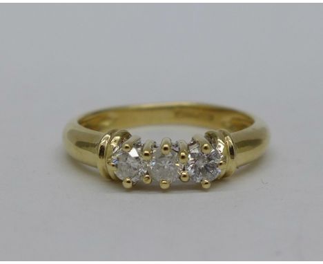 A 9ct gold and three stone diamond ring, weight 2.2g, size K