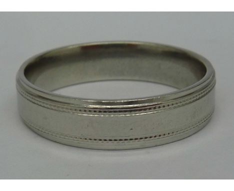 A platinum wedding band, weight 7.9g, size R