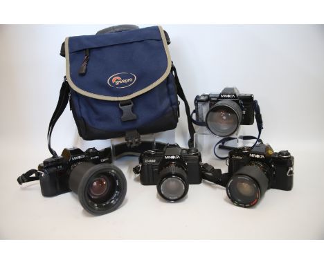 Four Minolta 35mm Cameras with various lens plus a Soft Camera carry bag.  See Photos.