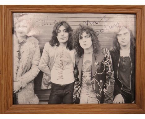 Small Framed Print of T.Rex and Marc Bolan which have signatures  (unverified) of the Band Members. Frame size 9 x 7 inches. 