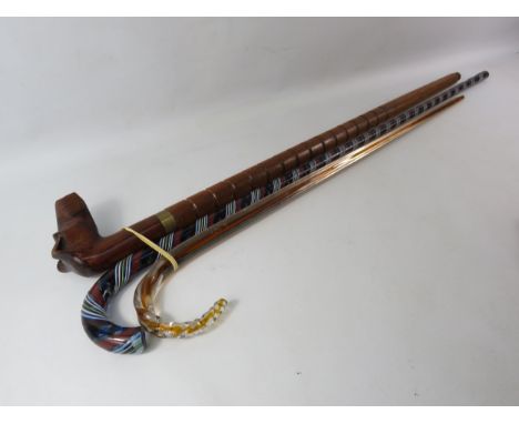 2 Victorian glass walking stick plus one wooden walking stick with carved handle in the form of a dog, the longest measures 3