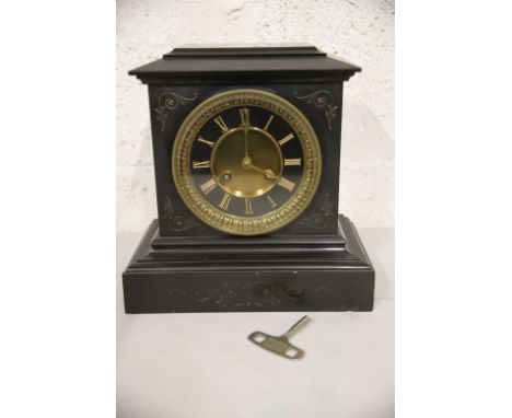 Slate Bodied mantle clock with key and pendulum in working order.  10.5 inches tall. See photos. 