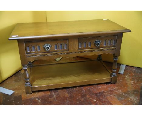Two Door  Wood Brothers Old Charm Style Two Drawer occasional table with shelf under. H:29 x W:35 X D:18 inches. All in good 