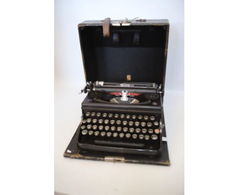 Vintage 'Triumph' Portable Typewriter with original carry case. Appears to be in working order. See photos.