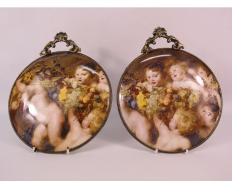 Two Limoges decorative ceramic wall plaques with ornate metal surrounds, 7 3/4" diameter.