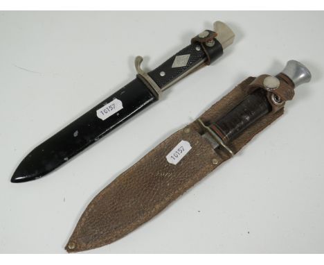 Solingen, German Made Boy Scout Knife with emblem embedded to handle and metal scabbard, along with a Sheffield made vintage 