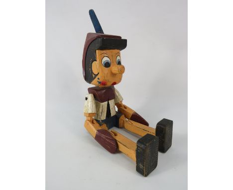 Wooden Pinocchio shelf sitter.