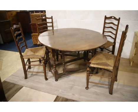 Antique Oak Gate leg drop leaf table . H:27 x W:49 x D:42 Inches. Along with four ladderback rush seated chairs. See photos. 