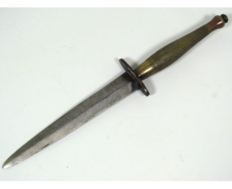 WWW2 Era Fairbairn Sykes Commando or Fighting Knife with original Leather scabbard. It is stamped to the fingerguard ..B2..an